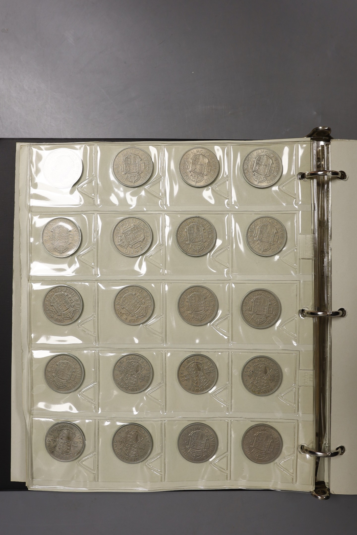 An album of British crowns, halfcrowns, florins and decimal 50 pence and 20 pence coins, including 1819 crown F, etc. and various loose UK coins and banknotes in envelopes